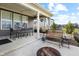 Relaxing covered patio area with outdoor dining furniture and a cozy outdoor bench at 4148 Basswood Dr, Danville, IN 46122