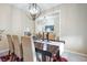 Dining room with a view of the living room and a decorative table setting at 4148 Basswood Dr, Danville, IN 46122