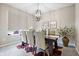 Dining room with carpet, modern light fixture and a large window at 4148 Basswood Dr, Danville, IN 46122