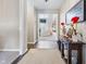 Bright foyer with hardwood floors that flows into a living room at 4148 Basswood Dr, Danville, IN 46122