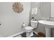 Elegant half bath with modern fixtures and stylish decor at 4148 Basswood Dr, Danville, IN 46122