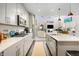 Open-concept kitchen features modern appliances, an island, and a seamless transition to the living area at 4148 Basswood Dr, Danville, IN 46122