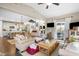 Inviting open-concept living room featuring hardwood floors and seamless access to the kitchen and outdoor patio at 4148 Basswood Dr, Danville, IN 46122