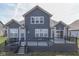 Exterior view of a backyard with a deck and gray siding at 4182 Backstretch Ln, Bargersville, IN 46106