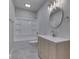 Bright bathroom with a white tub/shower combo and modern vanity with light wood at 4182 Backstretch Ln, Bargersville, IN 46106