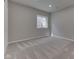 Bedroom featuring neutral walls, new carpet, and a window providing natural light at 4182 Backstretch Ln, Bargersville, IN 46106