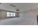 Large bonus room featuring plush carpeting, neutral paint, natural light, and staircase banister at 4182 Backstretch Ln, Bargersville, IN 46106