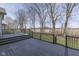 Wood deck with black railing and steps offering a view of the yard and the neighborhood at 4182 Backstretch Ln, Bargersville, IN 46106