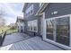 Wood deck with sliding glass doors and view of the gray siding at 4182 Backstretch Ln, Bargersville, IN 46106