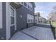 Wide view of wood deck featuring railing and gray siding, with windows along the home at 4182 Backstretch Ln, Bargersville, IN 46106