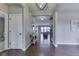 Spacious entryway with gleaming hardwood floors and an open floor plan at 4182 Backstretch Ln, Bargersville, IN 46106