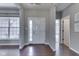 Welcoming foyer with hardwood floors, large windows, and lots of natural light at 4182 Backstretch Ln, Bargersville, IN 46106