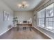 Bright home office with large window, elegant lighting, and a modern desk at 4182 Backstretch Ln, Bargersville, IN 46106
