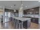 Kitchen island with stainless steel appliances and stylish pendant lighting at 4182 Backstretch Ln, Bargersville, IN 46106