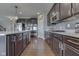 Modern kitchen featuring granite countertops, stainless steel appliances, and tile backsplash at 4182 Backstretch Ln, Bargersville, IN 46106