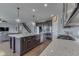 Island kitchen with stainless steel appliances, granite countertops, and eat-in breakfast bar at 4182 Backstretch Ln, Bargersville, IN 46106