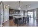 Open kitchen with stainless steel appliances and seating at island at 4182 Backstretch Ln, Bargersville, IN 46106