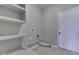 Laundry room with tile floor, utility sink, shelving, and washer and dryer hookups at 4182 Backstretch Ln, Bargersville, IN 46106