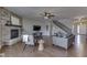Spacious living room with hardwood floors, stone fireplace, and a seamless open layout at 4182 Backstretch Ln, Bargersville, IN 46106