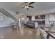 Spacious living room with hardwood floors, neutral walls, and modern furnishings open to kitchen at 4182 Backstretch Ln, Bargersville, IN 46106