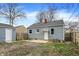 Home's backyard featuring a patio, light gray siding, and fenced yard at 5309 E 19Th Pl, Indianapolis, IN 46218