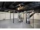 Spacious basement with painted floors and ceiling, utility components and a hot water tank at 5309 E 19Th Pl, Indianapolis, IN 46218