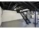 Unfinished basement with white-painted walls, exposed pipes, and stairs at 5309 E 19Th Pl, Indianapolis, IN 46218
