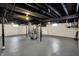 Spacious basement with painted floors and ceiling, utility components and a furnace at 5309 E 19Th Pl, Indianapolis, IN 46218