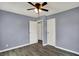 Bedroom features a ceiling fan, two closets, and a window, offering storage and natural light at 5309 E 19Th Pl, Indianapolis, IN 46218
