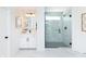 Modern bathroom featuring a glass shower and white cabinets with sleek black hardware at 540 Galveston Ln, Westfield, IN 46074