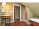 Unique bathroom with clawfoot tub, rustic vanity and walk-in shower at 5915 Lowell Ave, Indianapolis, IN 46219