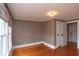 Cozy bedroom with neutral walls, hardwood floors, and a window providing natural light, offering a comfortable retreat at 5915 Lowell Ave, Indianapolis, IN 46219