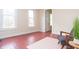 Inviting bedroom with hardwood floors, a modern decor, and two windows letting in plenty of light at 5915 Lowell Ave, Indianapolis, IN 46219