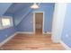 Charming bedroom featuring light blue walls, hardwood floors, and natural light, creating a serene and inviting space at 5915 Lowell Ave, Indianapolis, IN 46219