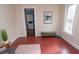 Inviting living room with hardwood floors, a modern decor, and access to the bright kitchen at 5915 Lowell Ave, Indianapolis, IN 46219