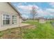Spacious backyard with a well-maintained lawn, a storage shed, and partial privacy fence at 607 N White Ash N Ct, Mooresville, IN 46158