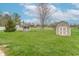 Serene backyard featuring a storage shed and a green lawn area at 607 N White Ash N Ct, Mooresville, IN 46158