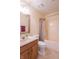 Standard bathroom featuring a vanity, mirror, toilet, and shower with tan and neutral color palette at 607 N White Ash N Ct, Mooresville, IN 46158