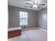 Cozy bedroom with a ceiling fan and a window providing natural light with carpeted floor at 607 N White Ash N Ct, Mooresville, IN 46158