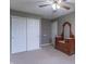 Bedroom featuring a ceiling fan, double door closet, neutral walls, carpeted floors, and furnishings at 607 N White Ash N Ct, Mooresville, IN 46158
