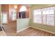 Bright kitchen nook with wood floors, updated lighting, and large window letting in natural light at 607 N White Ash N Ct, Mooresville, IN 46158