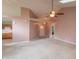 Inviting living room boasts neutral walls, skylights, ceiling fan, and open access to the adjacent kitchen area at 607 N White Ash N Ct, Mooresville, IN 46158