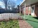 Brick house with paved yard featuring a basketball hoop at 6105 E St Joseph St, Indianapolis, IN 46219