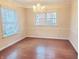 Elegant dining room with hardwood floors, large windows and a chandelier at 6105 E St Joseph St, Indianapolis, IN 46219