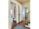 Inviting entryway featuring hardwood floors, classic trim, with doorways to other rooms at 6105 E St Joseph St, Indianapolis, IN 46219
