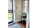 Charming foyer with a decorative security door, hardwood floors and a window with a garden view at 6105 E St Joseph St, Indianapolis, IN 46219