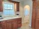 Traditional kitchen with wooden cabinets and a double sink, offering ample storage at 6105 E St Joseph St, Indianapolis, IN 46219