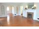 Bright living room with hardwood floors, fireplace, and arched doorways for a classic style at 6105 E St Joseph St, Indianapolis, IN 46219