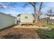 Charming backyard featuring a wooden deck and a cozy fire pit area for entertaining at 621 Melvenia St, Indianapolis, IN 46219