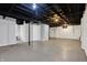 An unfinished basement featuring painted walls, open ceilings, and concrete floor at 621 Melvenia St, Indianapolis, IN 46219